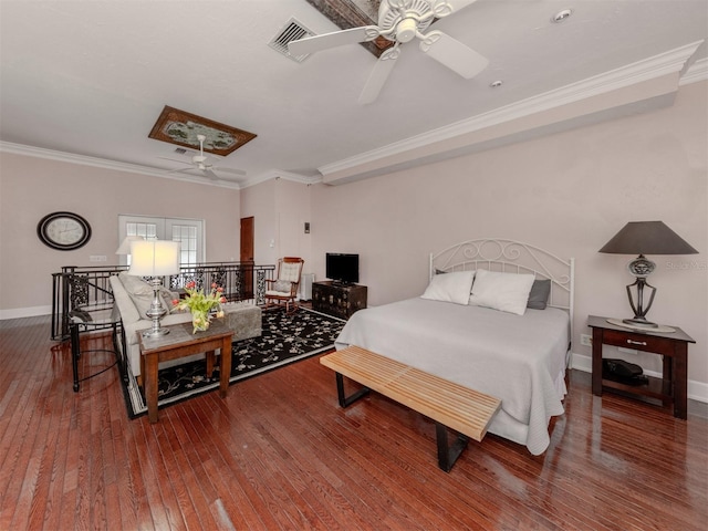 bedroom with crown molding, wood-type flooring, and ceiling fan