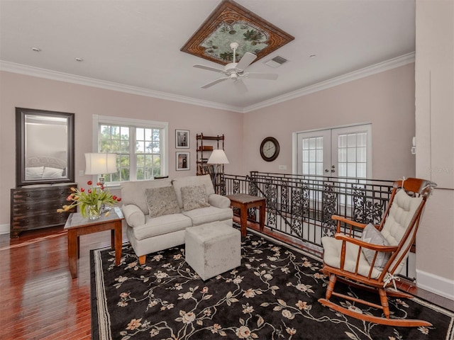 living room featuring crown molding, ceiling fan, french doors, and hardwood / wood-style flooring