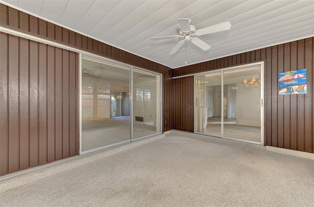 unfurnished sunroom with ceiling fan