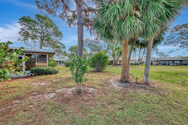 view of yard with a sunroom