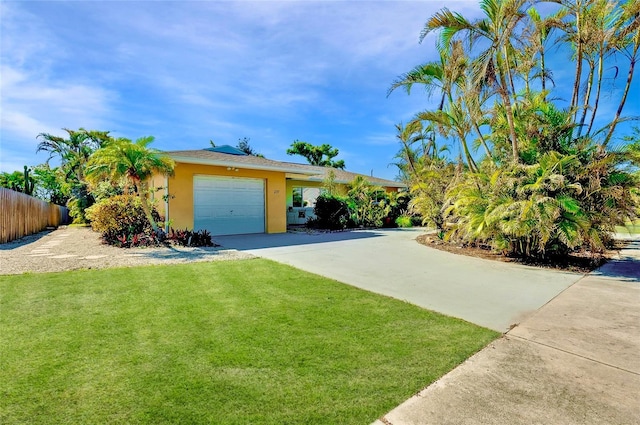 view of front facade with a garage and a front yard