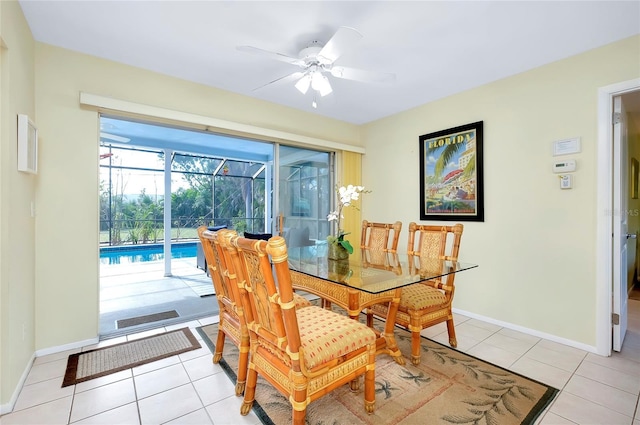 dining room featuring light tile patterned floors and ceiling fan