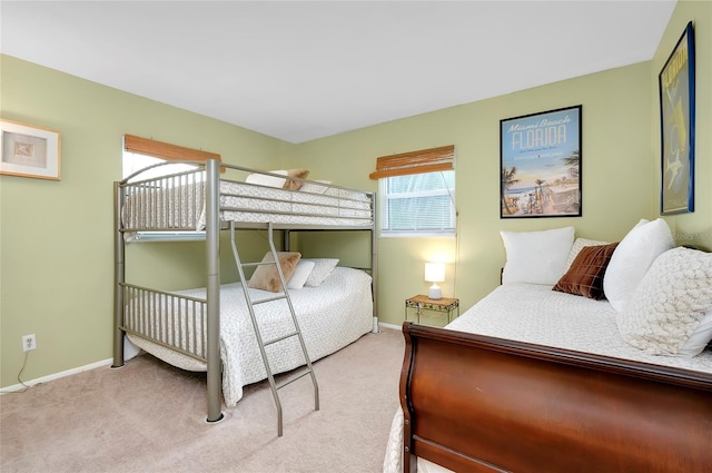 bedroom featuring light carpet