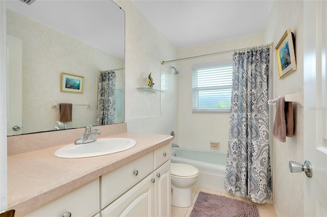 full bathroom featuring shower / tub combo with curtain, tile patterned floors, toilet, and vanity