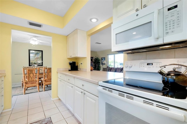 kitchen with white cabinetry, white appliances, ceiling fan, and light tile patterned floors