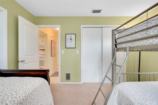 bedroom with carpet floors and a closet