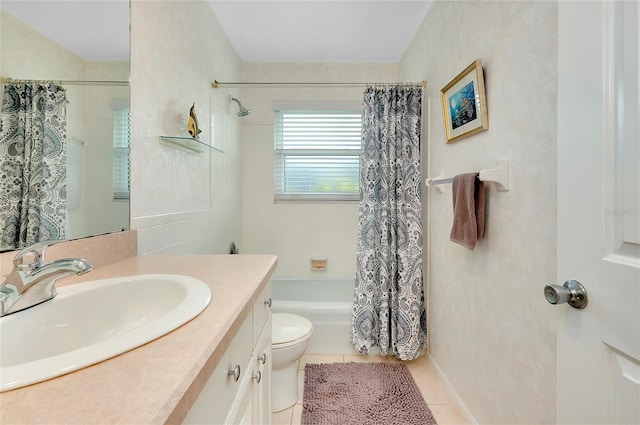 full bathroom featuring shower / bath combination with curtain, tile patterned floors, toilet, and vanity