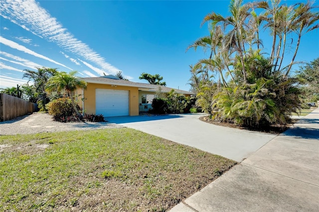 view of front facade with a garage and a front yard