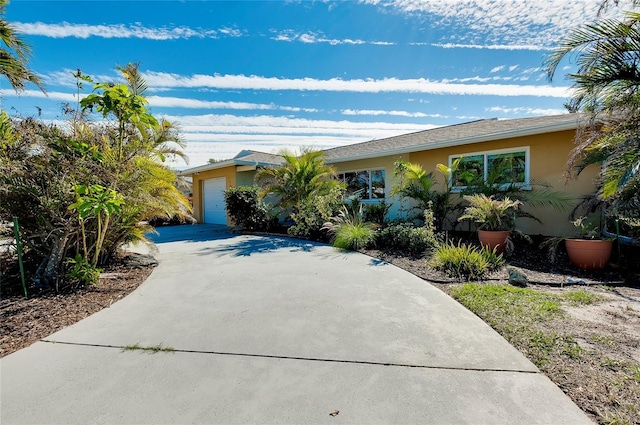 ranch-style home featuring a garage