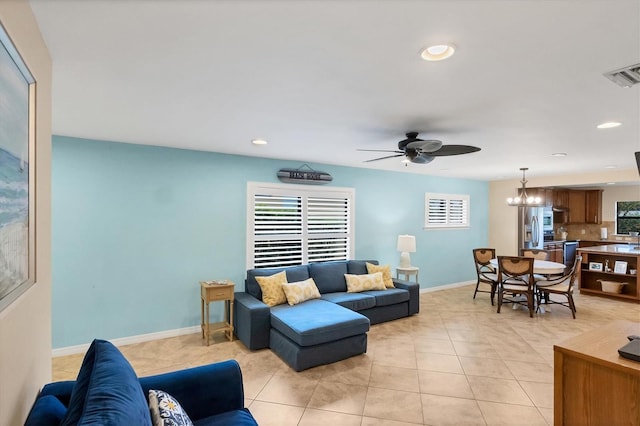 tiled living room featuring ceiling fan