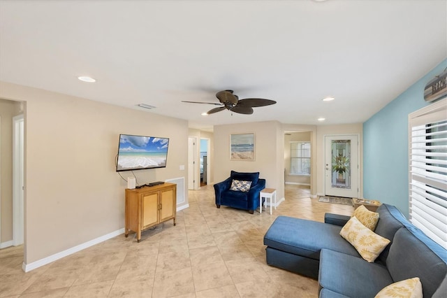 living room featuring ceiling fan and light tile patterned flooring