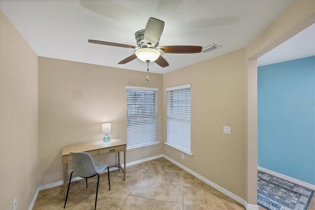 tiled home office with ceiling fan