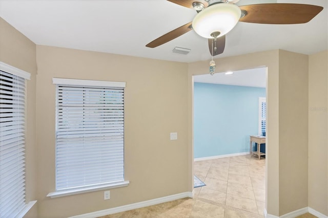 hall featuring light tile patterned flooring