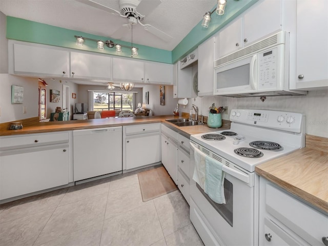 kitchen featuring sink, white appliances, white cabinets, and ceiling fan