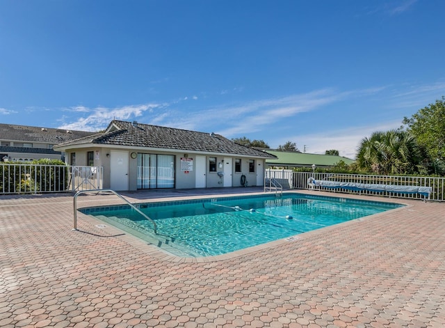 view of swimming pool with a patio area