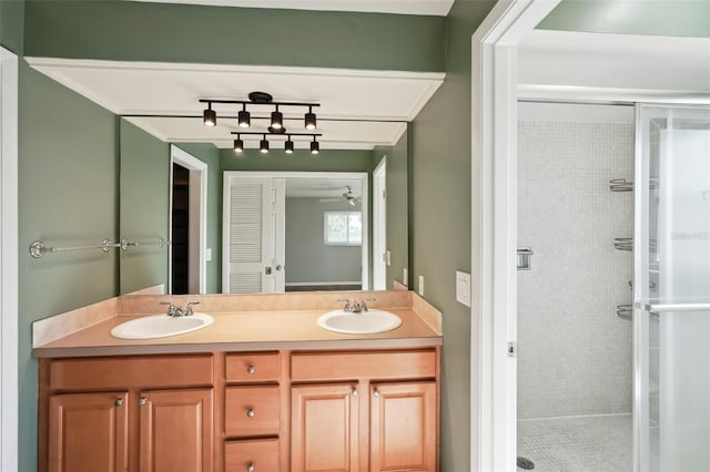 bathroom featuring vanity and a shower with door