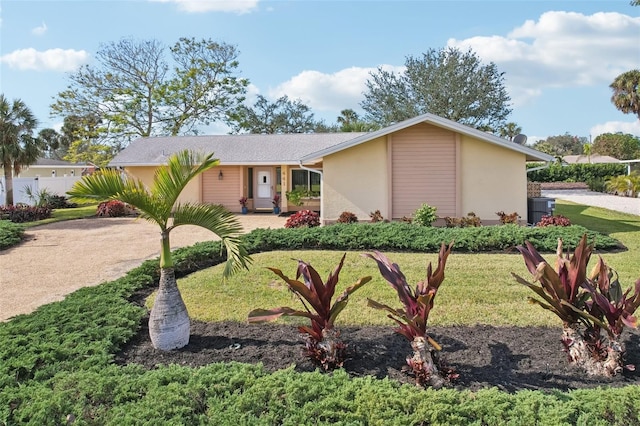 ranch-style home with a front lawn