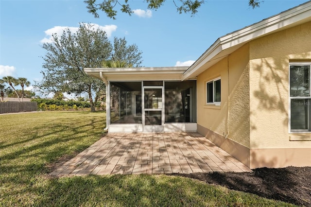 view of patio with a sunroom