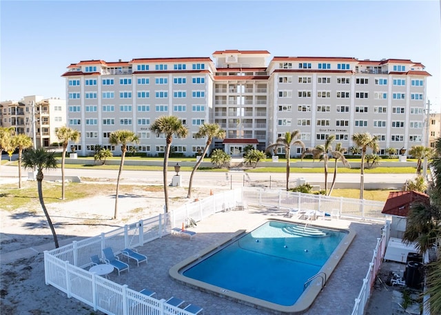 view of swimming pool with a patio area