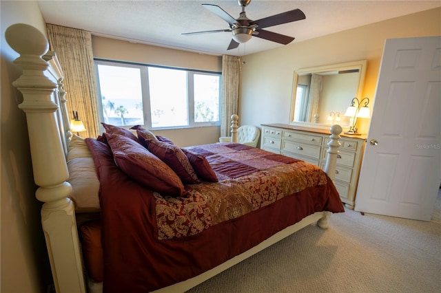 bedroom with ceiling fan and carpet flooring