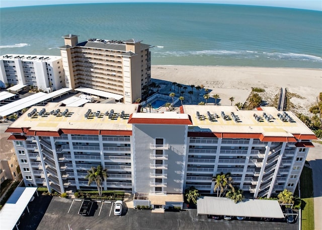 birds eye view of property with a view of the beach and a water view