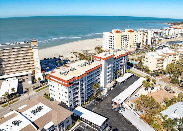 drone / aerial view with a water view and a view of the beach