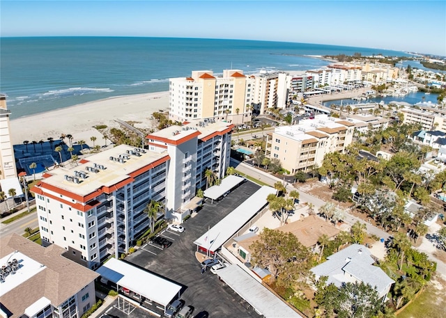 bird's eye view featuring a water view and a view of the beach