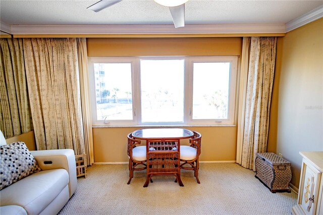 interior space featuring ornamental molding and light colored carpet