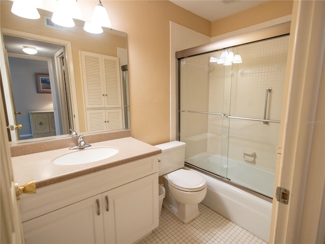 full bathroom with vanity, tile patterned floors, enclosed tub / shower combo, and toilet