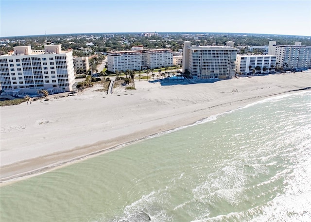 aerial view featuring a water view and a beach view