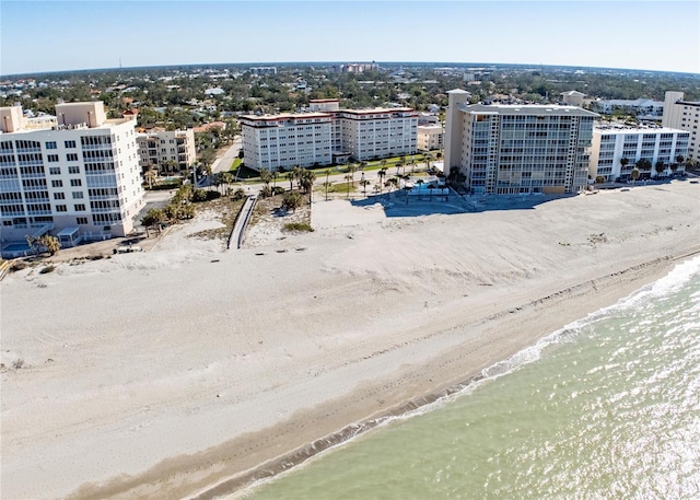 aerial view featuring a water view and a beach view