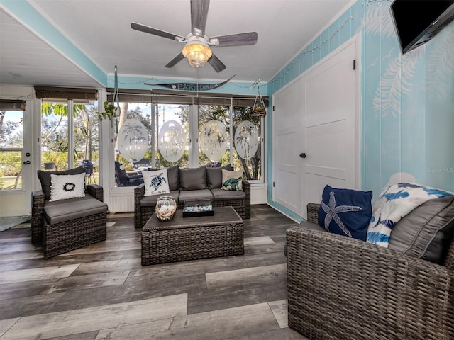 interior space with ceiling fan and wood finished floors