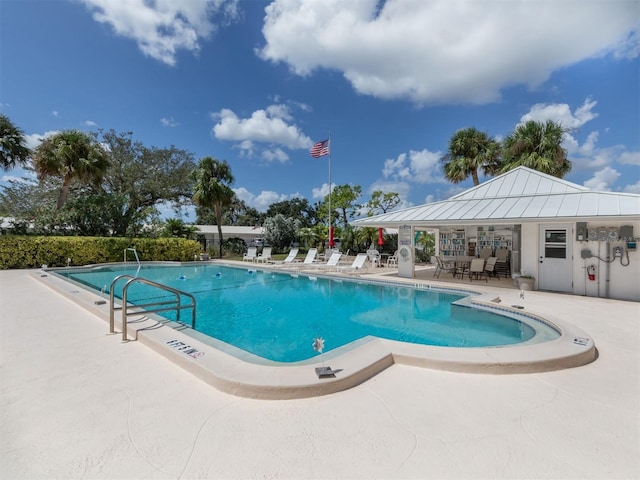 community pool featuring a patio area