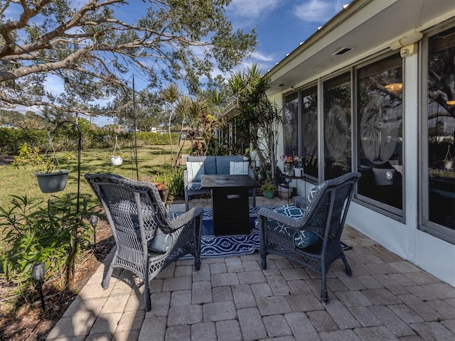 335 Englewood Isles Parkway Unit 55, Englewood, FL 34223 - view of patio / terrace with a fire pit