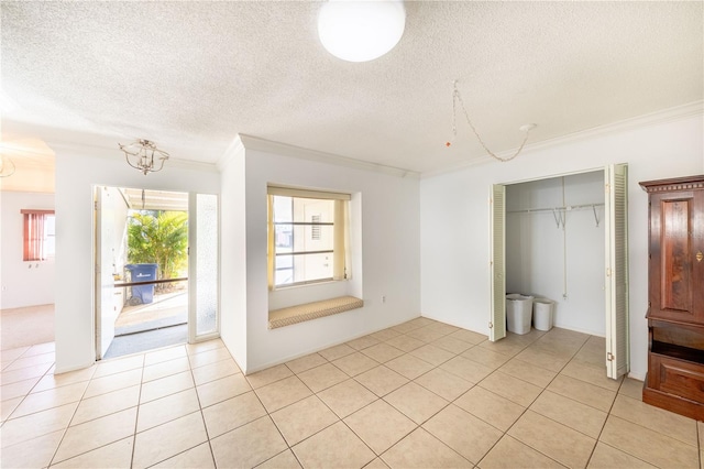 unfurnished bedroom with light tile patterned flooring, crown molding, a closet, and a textured ceiling