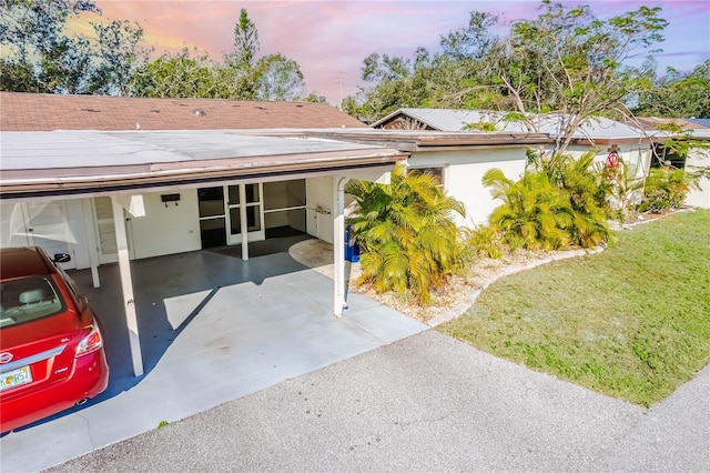 view of front of property featuring a carport