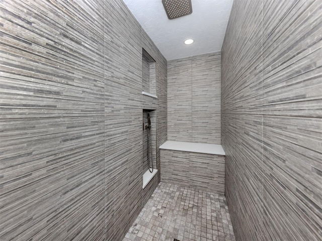 bathroom featuring tiled shower