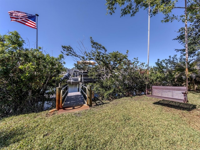 view of yard featuring a dock