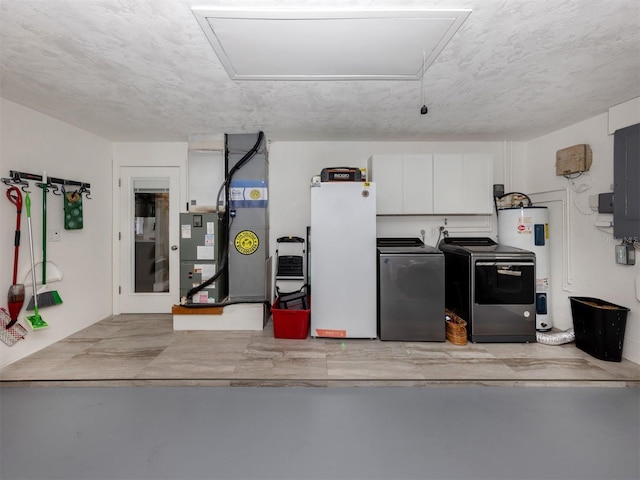 garage featuring separate washer and dryer, refrigerator, and electric water heater