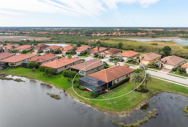 drone / aerial view with a water view