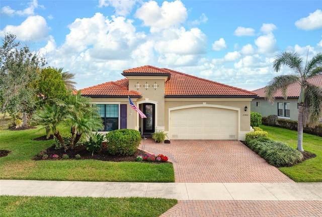 mediterranean / spanish-style home with a garage and a front lawn