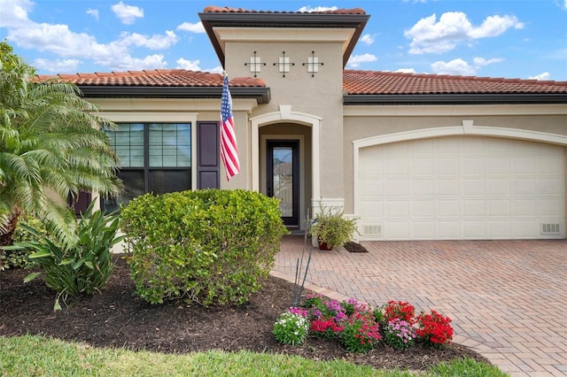 mediterranean / spanish-style home featuring a garage