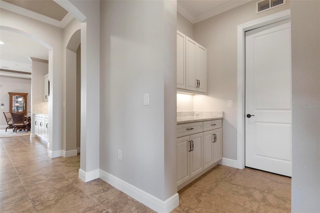 hall featuring ornamental molding