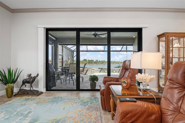 sitting room with ornamental molding, ceiling fan, and a water view