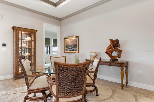 dining space featuring ornamental molding