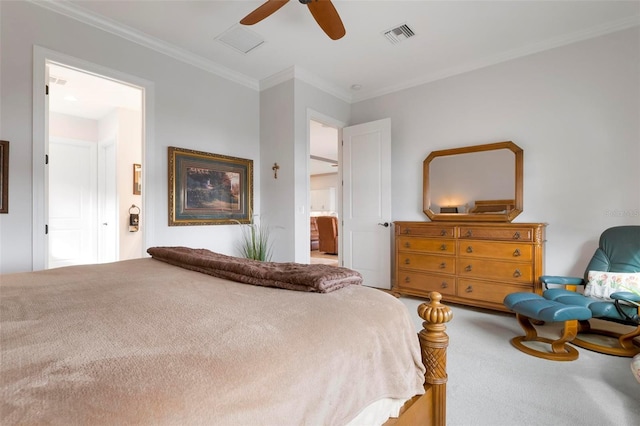 bedroom featuring ceiling fan, ornamental molding, carpet flooring, and connected bathroom