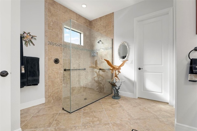 bathroom featuring a tile shower