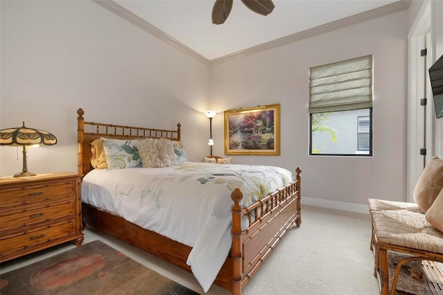 carpeted bedroom with ornamental molding and ceiling fan