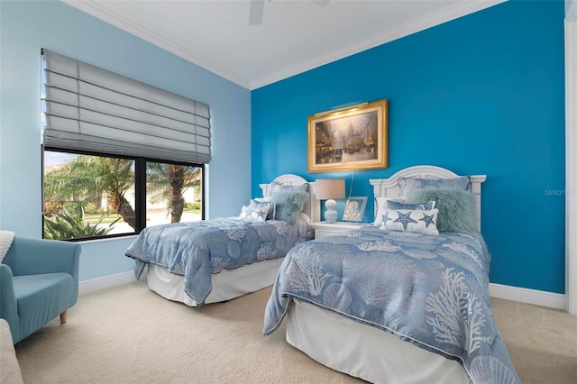 carpeted bedroom featuring ceiling fan and ornamental molding