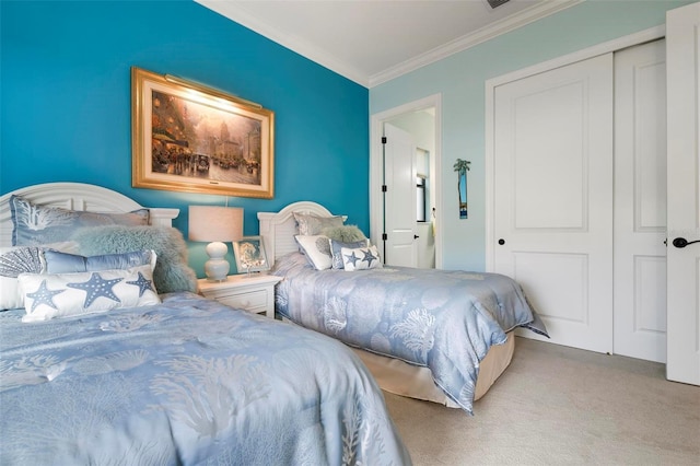 carpeted bedroom featuring ornamental molding and a closet